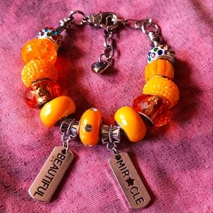 Silver snake chain charm bracelet with golden yellow glass beads and silvercharm